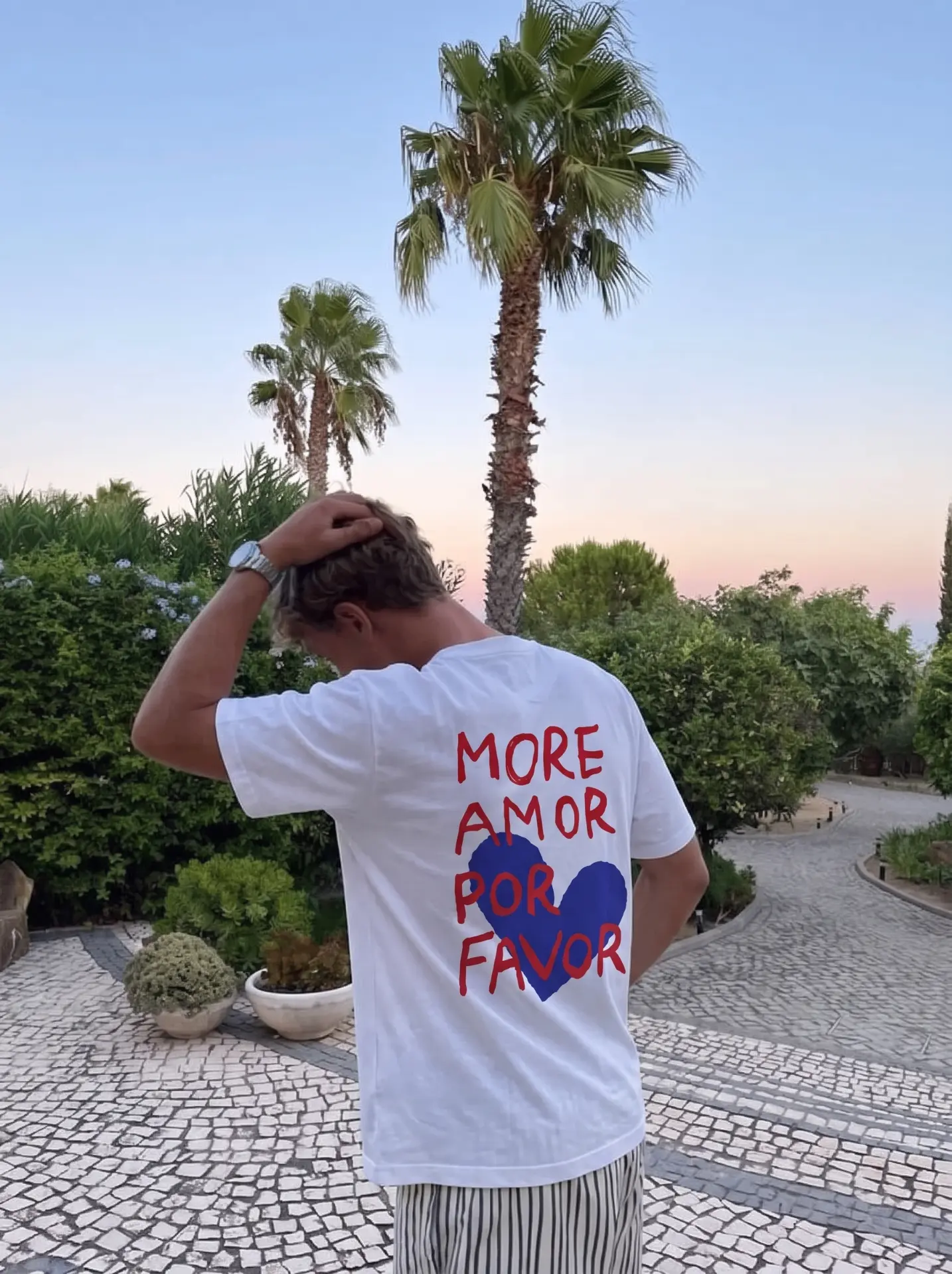 More amor por favor tee under the palms at sunset