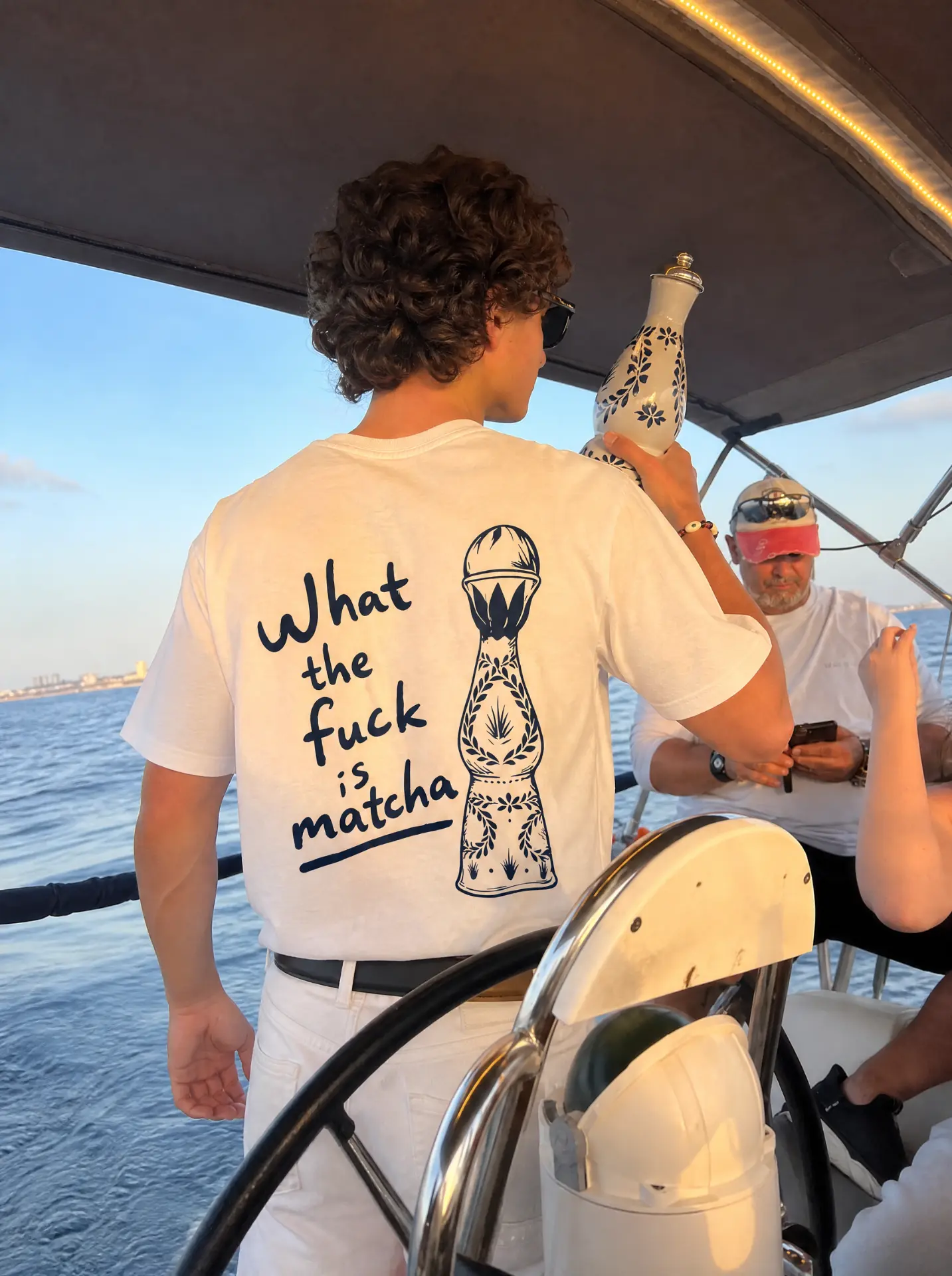 What the fuck is matcha tee at the helm of a sailboat