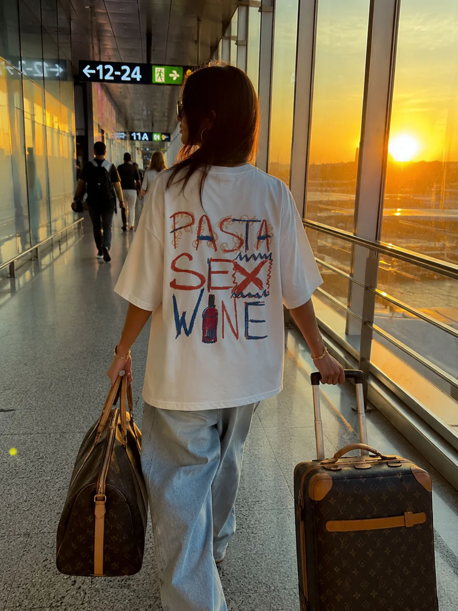 Pasta Sex Wine tee at sunset in the airport terminal